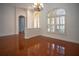Bright dining room with hardwood floors and a chandelier at 5038 Se 6Th Ave, Ocala, FL 34480