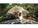House with stone accents and a nicely landscaped yard at 5038 Se 6Th Ave, Ocala, FL 34480
