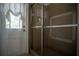 Large walk-in shower with tiled walls and glass enclosure at 5038 Se 6Th Ave, Ocala, FL 34480