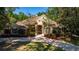 Large house with a stone facade and nicely landscaped yard at 5038 Se 6Th Ave, Ocala, FL 34480