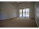Spacious main bedroom features sliding doors to the backyard pool at 5038 Se 6Th Ave, Ocala, FL 34480