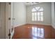 Bright bedroom with hardwood floors and window with shutters at 5038 Se 6Th Ave, Ocala, FL 34480