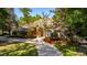 Spacious home with a welcoming front porch and lush landscaping at 5038 Se 6Th Ave, Ocala, FL 34480