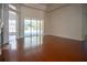 Spacious living room with hardwood floors and pool view at 5038 Se 6Th Ave, Ocala, FL 34480