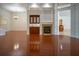 Living room with hardwood floors, fireplace, and built-in bar at 5038 Se 6Th Ave, Ocala, FL 34480