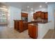 Large kitchen with wood cabinets, granite countertops, and a sizable island at 5038 Se 6Th Ave, Ocala, FL 34480