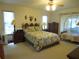 Spacious bedroom with a floral bedspread and plenty of closet space at 16789 Se 69Th Ln, Ocklawaha, FL 32179
