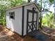 White storage shed with double doors and a ramp for easy access at 16789 Se 69Th Ln, Ocklawaha, FL 32179