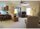 Open living room with adjacent kitchen and breakfast bar at 16789 Se 69Th Ln, Ocklawaha, FL 32179