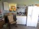 Wet bar with sink, mini-fridge and shelving at 16789 Se 69Th Ln, Ocklawaha, FL 32179