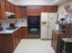 Kitchen with wood cabinets, double oven, and built-in microwave at 16789 Se 69Th Ln, Ocklawaha, FL 32179