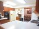 Kitchen with ample counter space, double sink, and view to the dining room at 16789 Se 69Th Ln, Ocklawaha, FL 32179