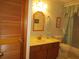 Clean bathroom with a vanity, toilet, and shower/tub combo at 16789 Se 69Th Ln, Ocklawaha, FL 32179
