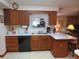 Bright kitchen features ample cabinetry and a double sink at 16789 Se 69Th Ln, Ocklawaha, FL 32179