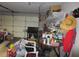Overcrowded garage with various items and tools at 16789 Se 69Th Ln, Ocklawaha, FL 32179