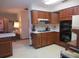 Kitchen with wood cabinets, white countertops, and appliances at 16789 Se 69Th Ln, Ocklawaha, FL 32179