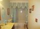 Bright bathroom featuring a bathtub, toilet and vanity at 16789 Se 69Th Ln, Ocklawaha, FL 32179