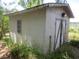 White storage shed with double doors and a ramp for easy access at 16789 Se 69Th Ln, Ocklawaha, FL 32179