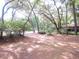 Spacious front yard with mature oak trees providing shade at 16789 Se 69Th Ln, Ocklawaha, FL 32179