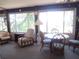 Sunroom with seating area, table, and view at 16789 Se 69Th Ln, Ocklawaha, FL 32179