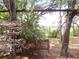 Relaxing garden swing nestled amongst trees, overlooking scenic views at 16789 Se 69Th Ln, Ocklawaha, FL 32179