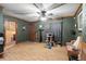 Spacious living room with laminate flooring and ceiling fan at 11531 Se 60Th Ave, Belleview, FL 34420
