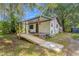 House exterior with covered porch and ramp access at 11531 Se 60Th Ave, Belleview, FL 34420