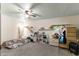 Simple bedroom with carpeting, ceiling fan and storage at 11531 Se 60Th Ave, Belleview, FL 34420