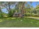 House exterior, large oak tree, grassy yard at 11531 Se 60Th Ave, Belleview, FL 34420