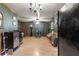 Bright living room, laminate floors, and ceiling fan at 11531 Se 60Th Ave, Belleview, FL 34420