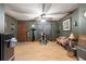 Living room with laminate floor, green walls, cat tree at 11531 Se 60Th Ave, Belleview, FL 34420