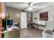 Cozy bedroom with a computer desk and window coverings at 11531 Se 60Th Ave, Belleview, FL 34420