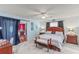 Spacious main bedroom with light blue walls, ceiling fan, and hardwood floors at 612 Fannich Ct, Leesburg, FL 34788