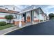 Exterior view of community recreation center with orange accents at 612 Fannich Ct, Leesburg, FL 34788