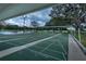 Three shuffleboard courts under a covered patio at 612 Fannich Ct, Leesburg, FL 34788