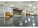 Large community room with stage and seating at 612 Fannich Ct, Leesburg, FL 34788