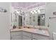 Bathroom with corner vanity, pink countertop, and a walk-in shower at 612 Fannich Ct, Leesburg, FL 34788