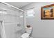 Clean bathroom featuring a walk-in shower and toilet at 612 Fannich Ct, Leesburg, FL 34788