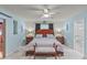 Main bedroom with ceiling fan, hardwood floors and access to bathroom at 612 Fannich Ct, Leesburg, FL 34788