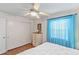 Comfortable bedroom with a queen-size bed and ample closet space at 612 Fannich Ct, Leesburg, FL 34788