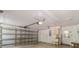 Garage with an overhead door, utility sink, and storage at 8975 Sw 202Nd Avenue Rd, Dunnellon, FL 34431