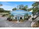 Blue and white community building with palm trees at 8975 Sw 202Nd Avenue Rd, Dunnellon, FL 34431