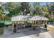 Covered picnic pavilion with tables and grills, perfect for outdoor gatherings at 8975 Sw 202Nd Avenue Rd, Dunnellon, FL 34431