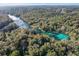 Aerial view of Rainbow River, revealing its stunning turquoise waters at 8975 Sw 202Nd Avenue Rd, Dunnellon, FL 34431