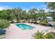 Inviting community pool with lounge chairs and umbrellas at 8975 Sw 202Nd Avenue Rd, Dunnellon, FL 34431