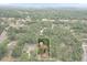Wide aerial view showing home's location in wooded area at 8975 Sw 202Nd Avenue Rd, Dunnellon, FL 34431