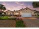Attractive single-story home with landscaped yard and paver driveway at 8678 Sw 83Rd Cir, Ocala, FL 34481