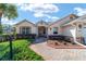 House entrance with a walkway and well-maintained landscaping at 8678 Sw 83Rd Cir, Ocala, FL 34481