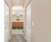 Double vanity bathroom with a large mirror, and access to walk-in closets at 8678 Sw 83Rd Cir, Ocala, FL 34481