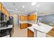 Spacious kitchen featuring an island, ample cabinetry, and modern appliances at 8678 Sw 83Rd Cir, Ocala, FL 34481